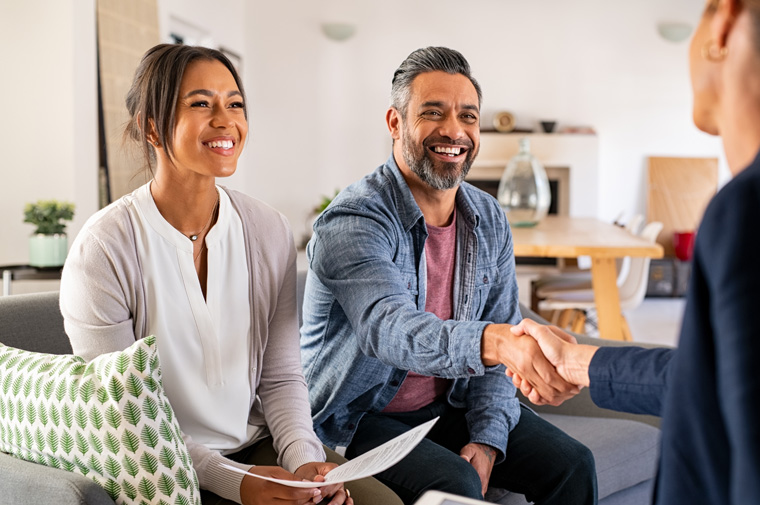middle aged couple in a client meeting with financial advisor